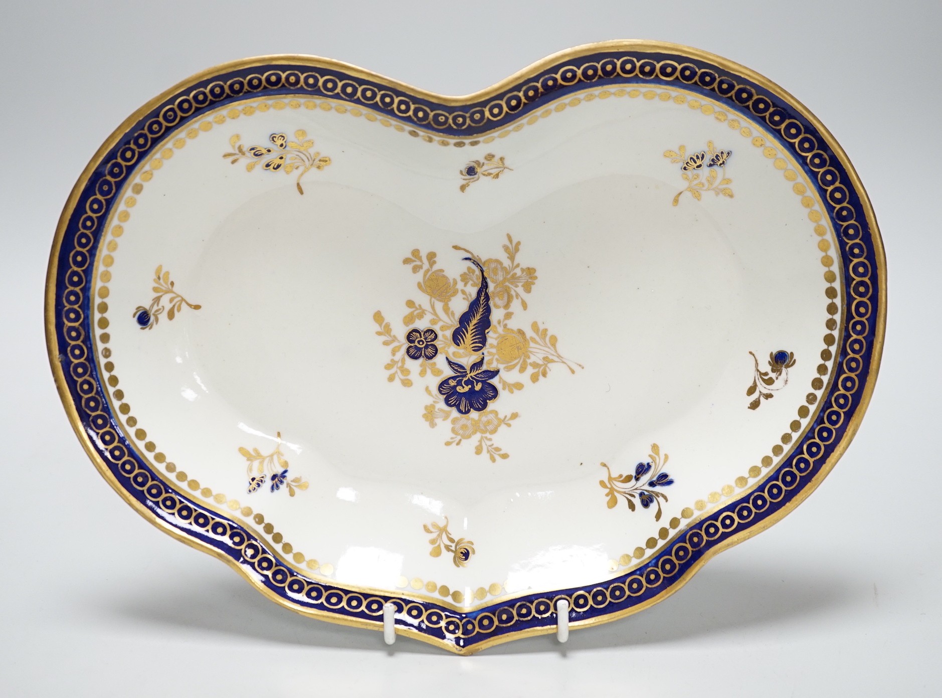 An 18th century Caughley kidney shaped dish with blue and gilt decoration, 28cms wide